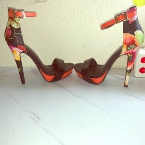 Black floral heels .